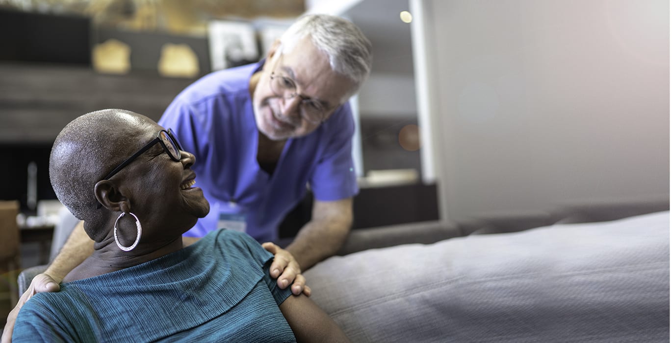 Doctor and patient talking at home
